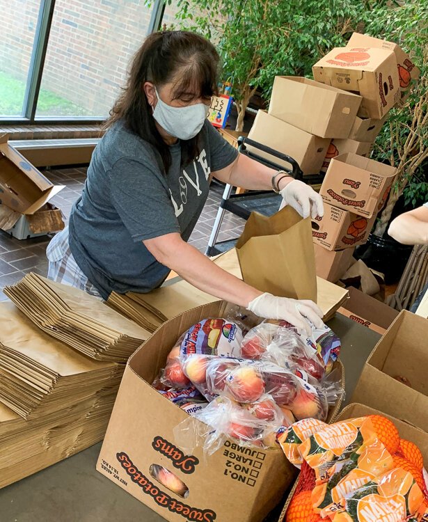 Dianna bagging apples